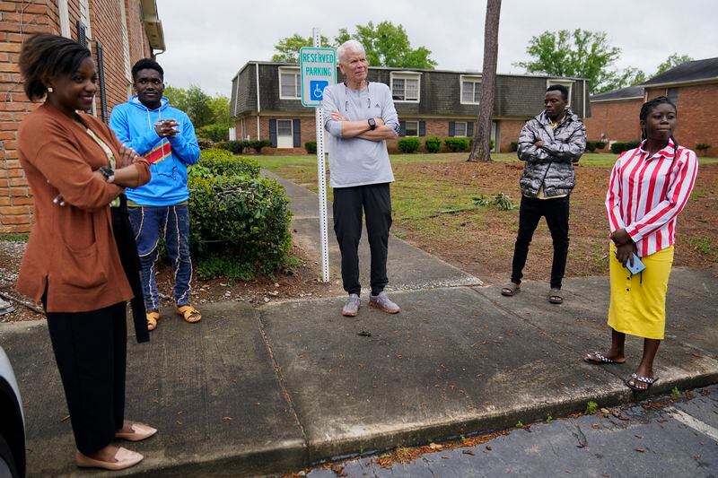 Lutheran Services Carolinas employment specialist Yvonne Songolo, left, and volunteer David Tait, center, get ready to present a new apartment to a refugee family from Congo, Thursday, April 11, 2024, in Columbia, S.C. The American refugee program, which long served as a haven for people fleeing violence around the world, is rebounding from years of dwindling arrivals under former President Donald Trump. The Biden administration has worked to restaff refugee resettlement agencies and streamline the process of vetting and placing people in America. (AP Photo/Erik Verduzco)