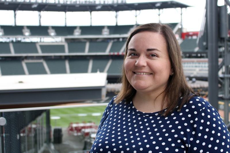 Katie Hearn began to lose her vision over a year ago. She was diagnosed with pseudotumor cerebri, a rare disorder. Now blind, she rebuilt her skills so she could still do her job in the social media department for the Atlanta Braves, which often means making games better for fans at SunTrust Park. JENNA EASON / JENNA.EASON@COXINC.COM
