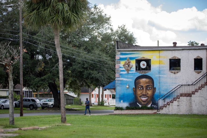 FILE — A mural depicting Ahmaud Arbery in Brunswick, Ga., on Oct. 16, 2021. The three white men convicted in state court of murdering Arbery are facing federal hate crime charges.  (Dustin Chambers/The New York Times)