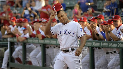 Rangers third baseman Adrian Beltre tips his hat to the fans during the celebration of his reaching the 3,000-hit plateau in September. (Max Faulkner/Fort Worth Star-Telegram/TNS)