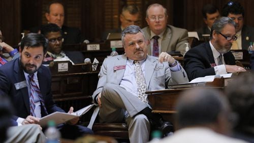 State Rep. Earl Ehrhart (center), R-Powder Springs, during the legislative session that ended last week. BOB ANDRES /BANDRES@AJC.COM