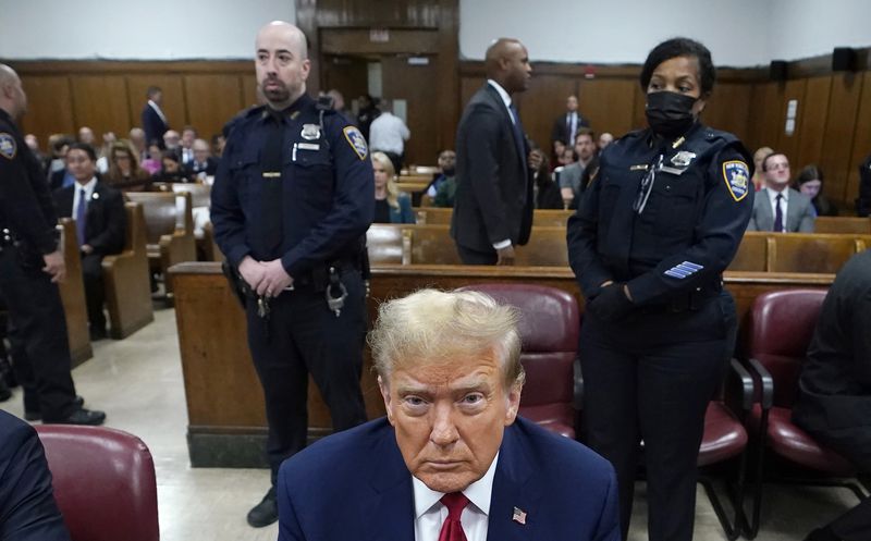 Former US President Donald Trump attends his trial for allegedly covering up hush money payments linked to extramarital affairs, at Manhattan Criminal Court in New York City, Tuesday April 23, 2024. Before testimony resumes Tuesday, the judge will hold a hearing on prosecutors' request to sanction and fine Trump over social media posts they say violate a gag order prohibiting him from attacking key witnesses. (Timothy A. Clary/Pool via AP)