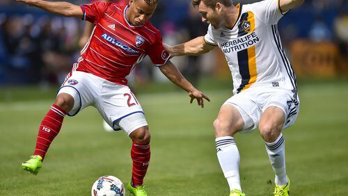FC Dallas midfielder Michael Barrios (21), of Colombia, battles Los Angeles Galaxy defender Dave Romney (4) during first half of an MLS soccer match, Saturday, March 4, 2017, in Carson, Calif. (AP Photo/Gus Ruelas)