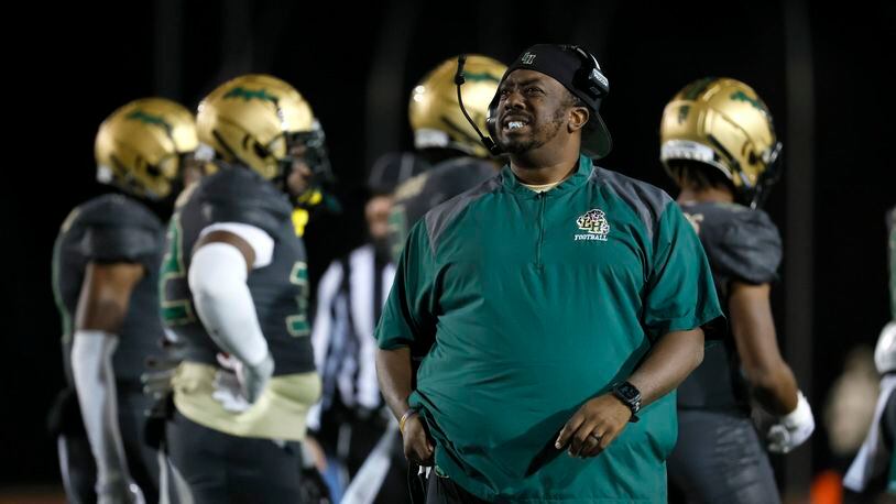 Langston Hughes head coach Daniel “Boone” Williams is shown on the sideline during their game against Rome in the Class 6A semifinal at Lakewood Stadium, Friday, December 2, 2022, in Atlanta. Jason Getz / Jason.Getz@ajc.com)