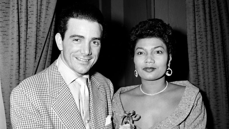Louis Bellson and Pearl Bailey in 1955, backstage at the Alvin Theatre in New York City. (AP Photo/Jack Harris)