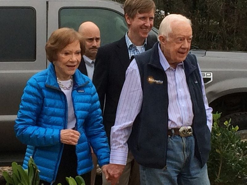 Rosalynn and Jimmy Carter arrive for a ceremony in February 2017 in Plains celebrating the construction of a solar “farm.” Jimmy Carter leased the 10-acre site he owns near his home to Atlanta-based SolAmerica Energy, which says the project will provide power to over 50 percent of Plains. Photo by Jill Vejnoska/jvejnoska@ajc.com