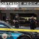 Law enforcement officers are seen on West Peachtree Street in front of Northside Hospital Midtown medical office building, where five people were shot on Wednesday, May 3, 2023. (Arvin Temkar/The Atlanta Journal-Constitution)