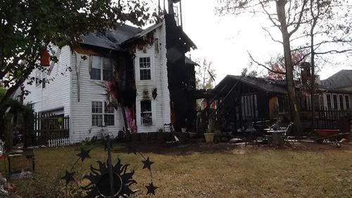 Two homes were damaged in a blaze that killed two cats in Lawrenceville.