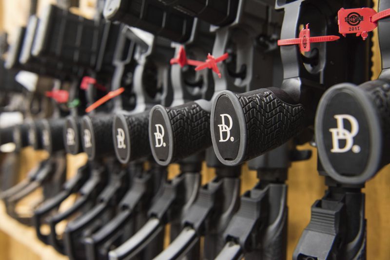 A row of rifles manufactured by Daniel Defense sits in a vault at the company’s headquarters in Black Creek, Ga., earlier this year. 
