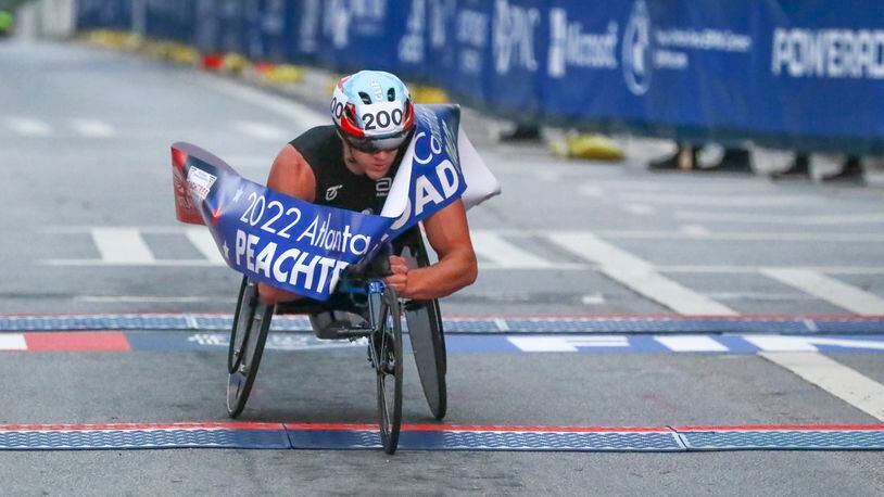 Daniel Romanchuk is the winner in the men's wheelchair division of the 53rd running of the Atlanta Journal-Constitution Peachtree Road Race in Atlanta on Monday, July 4, 2022. (Curtis Compton / Curtis.Compton@ajc.com)