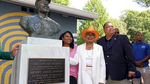 Atlanta City Councilwoman Andrea Boone (from left), Hank Aaron’s widow Billye Aaron and Councilman Michael Julian Bond stand next to the statue in honor of Hank Aaron at the newly renamed Henry Louis “Hank” Aaron Baseball Complex at Adams Park in the Aarons’ longtime neighborhood on Thursday, August 4, 2022. (Jason Getz / Jason.Getz@ajc.com)