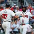 Atlanta Braves designated hitter Marcell Ozuna (20) celebrates his three-run home run with Austin Riley (27) during the first inning against the Boston Red Sox at Truist Park, Wednesday, May 8, 2024, in Atlanta.  (Jason Getz / AJC)