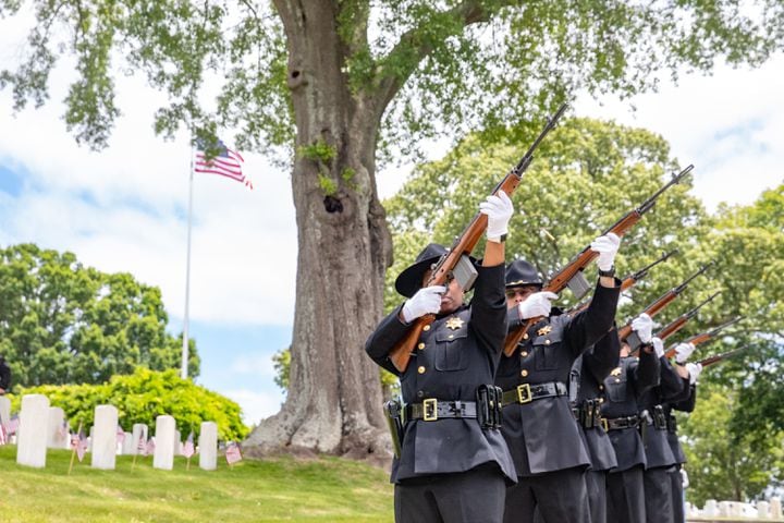 Cobb County Sheriff’s Honor Guard performs the 21 gun salute during the 77th annual Memorial Day Observance at the Marietta National Cemetery on Monday, May 29, 2003.  (Jenni Girtman for The Atlanta Journal-Constitution)
