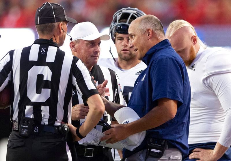Georgia Southern head coach Clay Helton, front right, argues with referees following a touchdown against Nebraska during the first half of an NCAA college football game Saturday, Sept. 10, 2022, in Lincoln, Neb. (AP Photo/Rebecca S. Gratz)