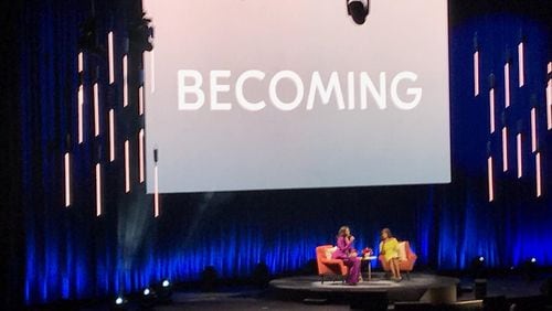 Former first lady Michelle Obama and TV journalist Gayle King, who served as moderator, took the stage on Saturday night, May 11, 2019, at State Farm Arena in Atlanta to discuss Obama's memoir, “Becoming.” (Photo: TYLER ESTEP / AJC)