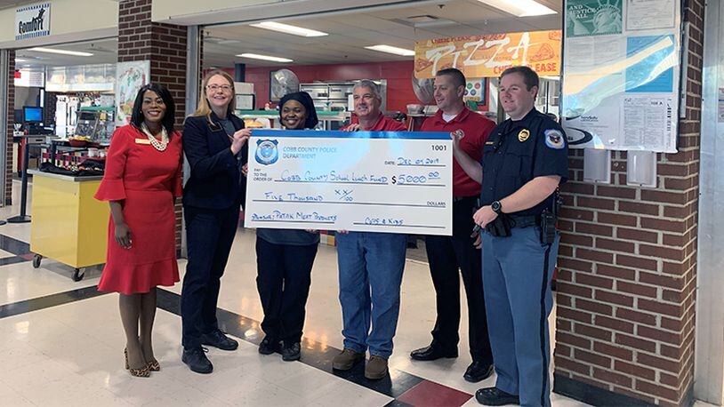 The Cobb County Police Department and the Fraternal Order of Police Lodge 13 donated $10,000 to pay off the lunch debt for Cobb students.