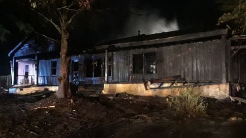 Four people were inside the Gwinnett County home when it caught fire.