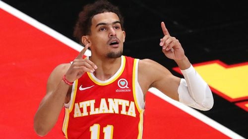 Hawks guard Trae Young reacts during first period action against the Washington Wizards  Wednesday, May 12, 2021, at State Farm Arena in Atlanta. Atlanta clinched a top-six playoff spot with a 120-116 win over the Wizards. (Curtis Compton / Curtis.Compton@ajc.com)