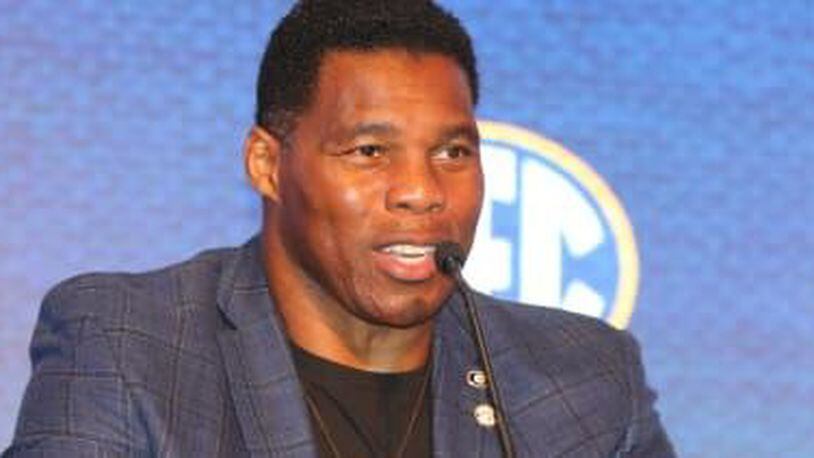 Herschel Walker’s campaign condemns bigotry, protesters want his thoughts on vaccine
