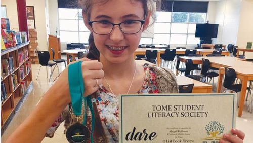 Woodstock Middle School student Abby Hallman won first place at the TomeCon annual statewide conference.