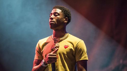 In this Aug. 25, 2017 file photo, NBA YoungBoy performs at the Lil' WeezyAna Fest at Champions Square in New Orleans.