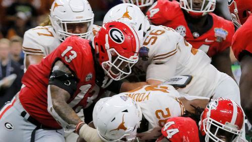 Georgia Bulldogs make stop of Texas Longhorns in the fourth quarter of the Allstate Sugar Bowl Jan. 1, 2019, at Mercedes-Benz Superdome in New Orleans. Georgia was defeated 28-21. (Bob Andres/bandres@ajc.com)