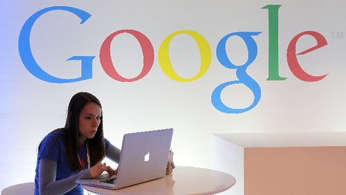 A Google employee works on a laptop before the start of a new conference about Google Maps on June 6, 2012 in San Francisco, California.