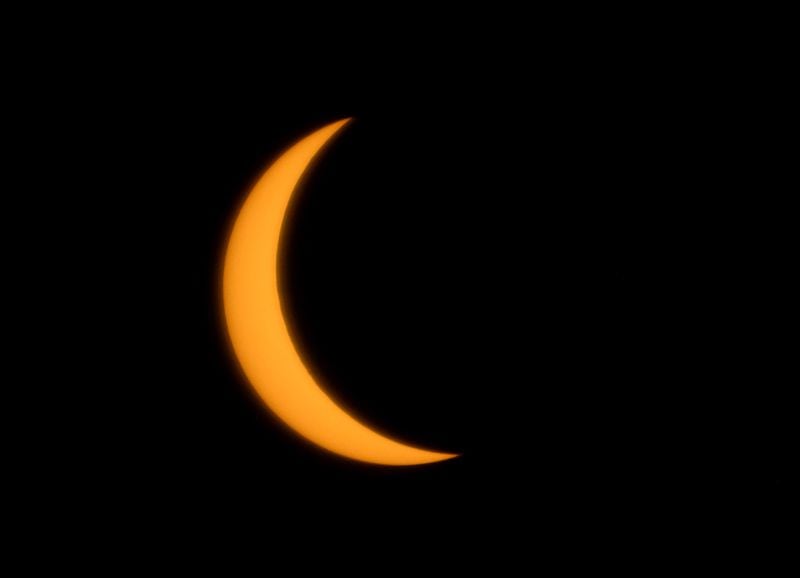 This eclipse photo was taken at 3:08 p.m., Monday, April 8, 2024, in Snellville. (Hyosub Shin / Hyosub.Shin@ajc.com)