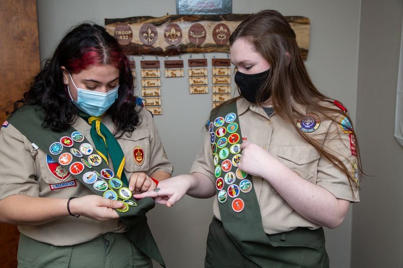 Zoe Rosenberg (left) & Veronica Roark explain what merit badges they earned to become Eagles Scouts at the Roswell United Methodist Church scout hut in Roswell. The two are part of the all-girls Scout Troop 432, that meets at the church on Thursday nights. They are the first girls in the Northern Ridge Scout District to earn the Eagle Scout rank, and are among the nation's Inaugural Class of Female Eagle Scouts. PHIL SKINNER FOR THE ATLANTA JOURNAL-CONSTITUTION.