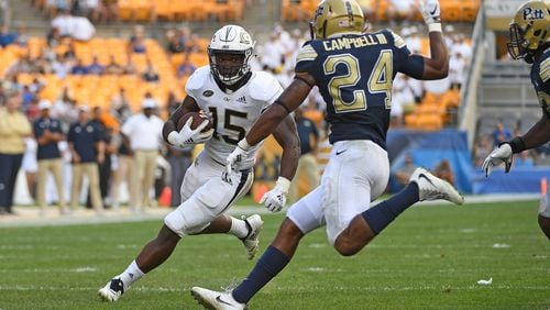 PITTSBURGH, PA - SEPTEMBER 15: Jerry Howard #15 of the Georgia Tech Yellow Jackets runs the ball against Phil Campbell III #24 of the Pittsburgh Panthers in the second half during the game at Heinz Field on September 15, 2018 in Pittsburgh, Pennsylvania. (Photo by Justin Berl/Getty Images)