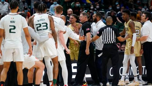 A scuffle breaks out during the second half of a college basketball game between Miami and Georgia Tech on Wednesday night in Coral Gables, Florida. (AP Photo/Wilfredo Lee)