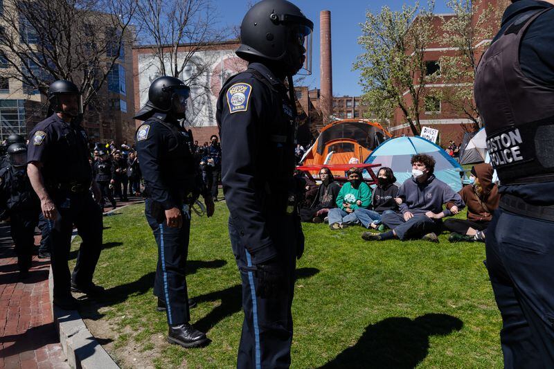 
                        Boston police officers surround a pro-Palestinian encampment at Northeastern University on Thursday, April 25, 2024. Some colleges that initiated police crackdowns on pro-Palestinian protests have since taken a different tack. Others have defended the move. Hundreds have been arrested. (Sophie Park/The New York Times)
                      