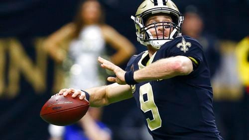 New Orleans Saints quarterback Drew Brees (9) works against against the Philadelphia Eagles in the first half of an NFL divisional playoff football game in New Orleans, Sunday, Jan. 13, 2019. (AP Photo/Butch Dill)