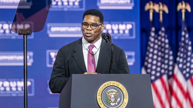 09/25/2020 - Atlanta, Georgia - Former professional football player Herschel Walker speaks to the crowd before introducing President Donal Trump during a Blacks for Trump campaign rally at the Cobb Galleria Centre in Atlanta, Friday, September 25, 2020.  (Alyssa Pointer / Alyssa.Pointer@ajc.com)