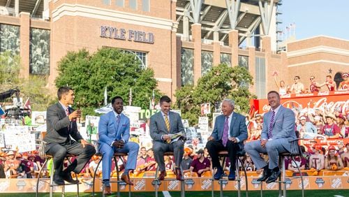 FILE - In this Sept. 8, 2018, file photo ,ESPN College Game Day's crew sits on set in front of Kyle Field in College Station, Texas. before the start of an NCAA college football game between Clemson and Texas A&M. After 15 years of the Washington State flag begin a backdrop fixture to every “College GameDay” broadcast, ESPN is going to Pullman Wash., on Saturday.(AP Photo/Sam Craft, File)
