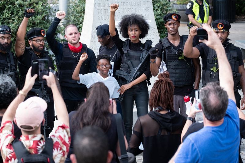 A group of Atlanta-area models and actors dressed as Black Panthers pose for a photo on the Decatur Square after a march and rally Wednesday afternoon, June 3, 2020. Members of the group say their intent was genuine, even if the outfits weren’t. BEN GRAY FOR THE AJC