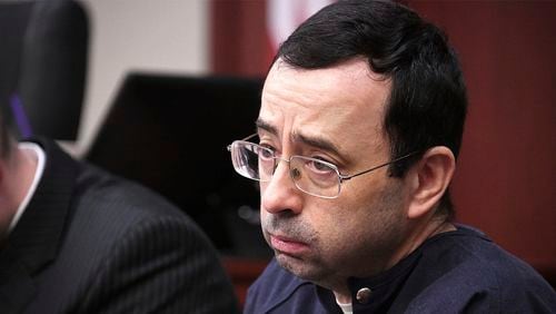 Larry Nassar looks at the gallery in the court during the sixth day of his sentencing hearing Tuesday, Jan. 23, 2018, in Lansing, Mich.