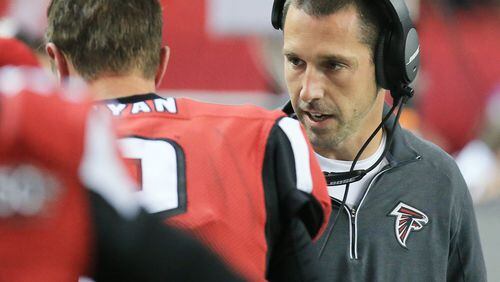 112915 ATLANTA: — Falcons offensive coordinator Kyle Shanahan confers with quarterback Matt Ryan on the sidelines after he fumbled the ball away to Vikings defensive end Brian Robison when he was sacked on a fourth down and one attempt during the fourth quarter in a football game on Sunday, Nov. 29, 2015, in Atlanta. The Vikings beat the Falcons 20-10. Curtis Compton / ccompton@ajc.com
