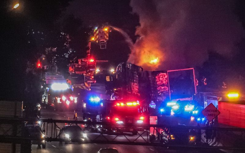 Authorities worked to extinguish a tractor-trailer fire that shut down the eastbound lanes of I-285 for hours Monday morning in Dekalb County.