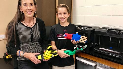 The Walker School student Anderson Carey, 12, and his science teacher, Dr. Holly Martin, created a 3D printed prosthetic arm for Cornel Crismaru, a Romanian man who lost a leg, hand and forearm to a bacterial infection.