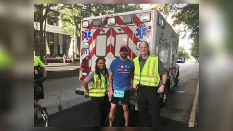 Richard Kalask, who worked 10 years as a paramedic at Grady Memorial Hospital, took a detour to greet friends at the AJC Peachtree Road Race. ANN ONIDIEKI/ SPECIAL