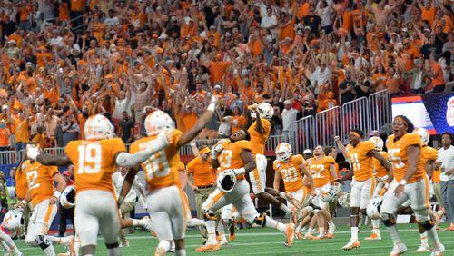 Tennessee players celebrate their 42-41 double overtime win over Georgia Tech Monday at Mercedes-Benz Stadium.