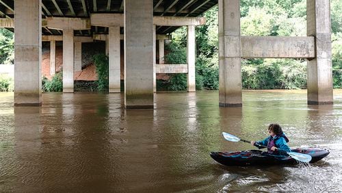 Parker Durance kayaks on the Chattahoochee River at Don White Memorial Park in Roswell on July 3, 2023. (Natrice Miller/ Natrice.miller@ajc.com)