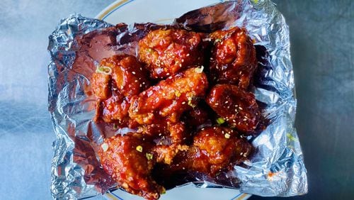 Yakitori Jinbei’s Korean fried chicken, glazed with a sweet chili sauce, travels quite well as takeout. Wendell Brock/For The AJC