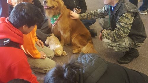 A little puppy love gave students at South Cobb High a break from test stress at the end of the December term. Contributed.