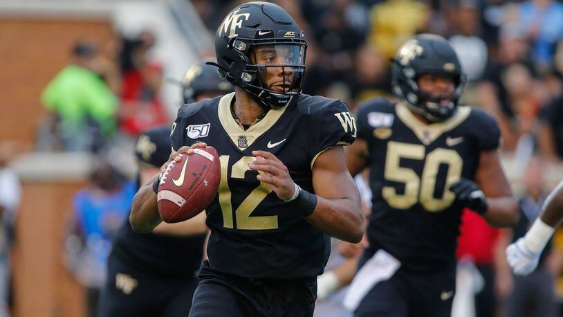 Wake Forest quarterback Jamie Newman looks to pass against North Carolina in Winston-Salem, N.C., Friday, Sept. 13, 2019. (AP Photo/Nell Redmond)