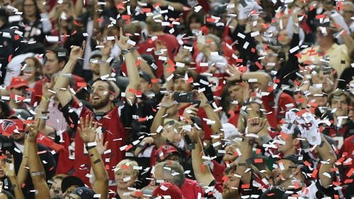 Falcons fans celebrate beating the Green Bay Packers in the NFC championship game to advance to the Super Bowl. Curtis Compton/ccompton@ajc.com