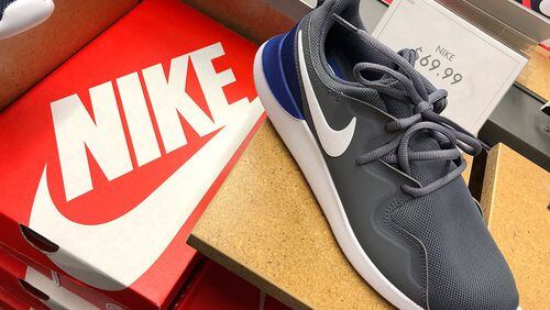 Nike shoes are displayed at a Nike store on Sept. 14, 2018, in San Francisco. A week after Nike released a “Just Do It” ad campaign that featured controversial former 49ers quarterback Colin Kaepernick, the company’s stock hit an all-time high. JUSTIN SULLIVAN / GETTY IMAGES