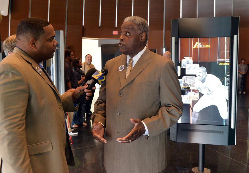 WSB-TV weekend sports anchor Anthony Amey interviews Hall of Famer Art Shell in the College Hall of Fame at a press conference and media day at the College Football Hall of Fame on Wednesday, August 20, 2014.