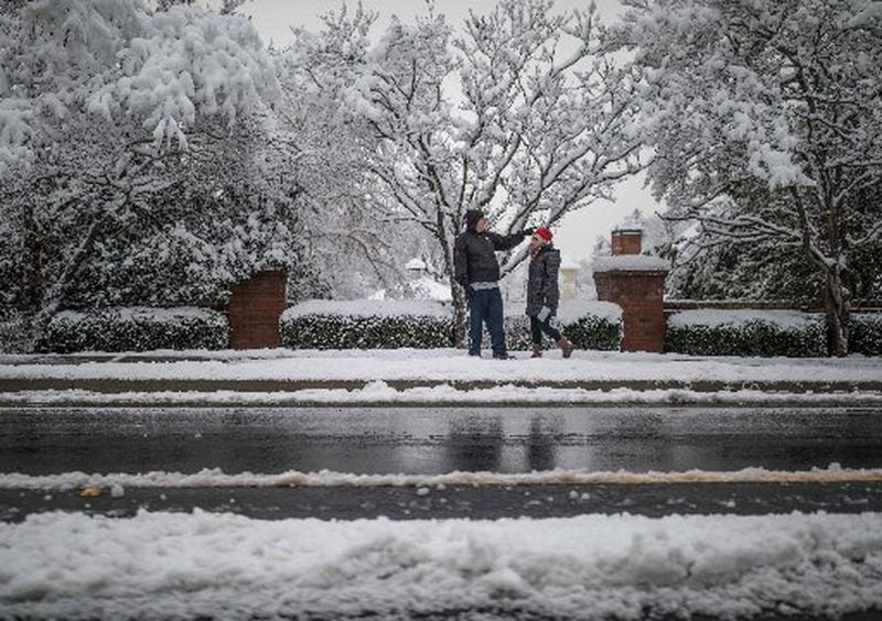 People walked along Shiloh Road in Kennesaw after a snowstorm hit metro Atlanta and North Georgia. Branden Camp/Special